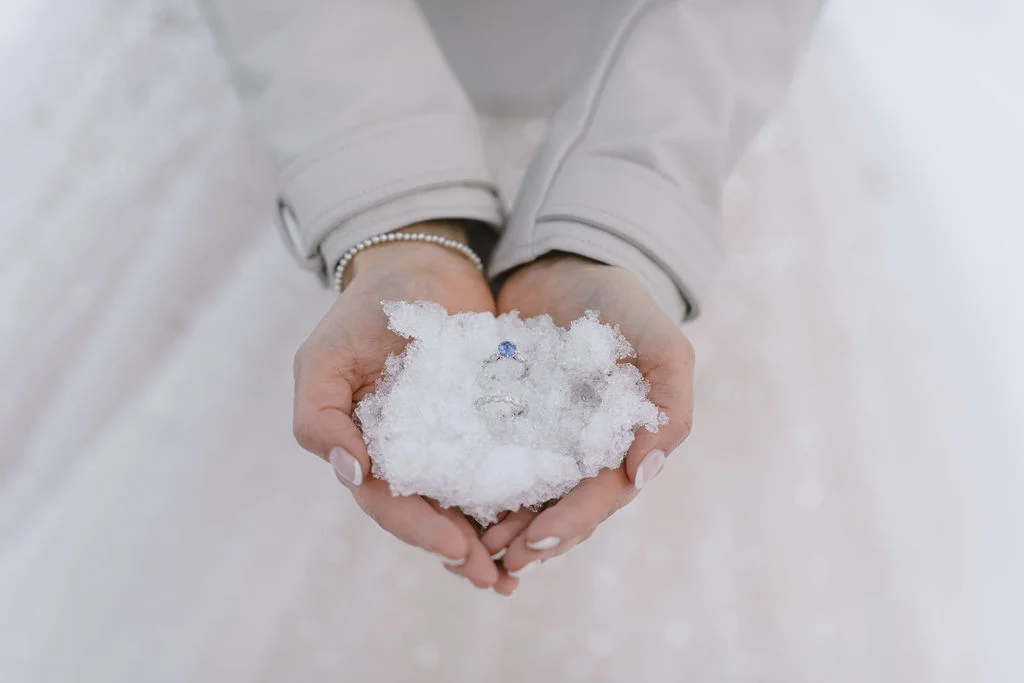 Why winter weddings are wonderful - wedding rings in snow.